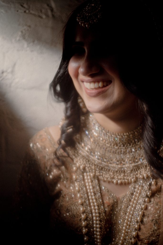 candid wedding photography in Gurgaon – bride laughing moment